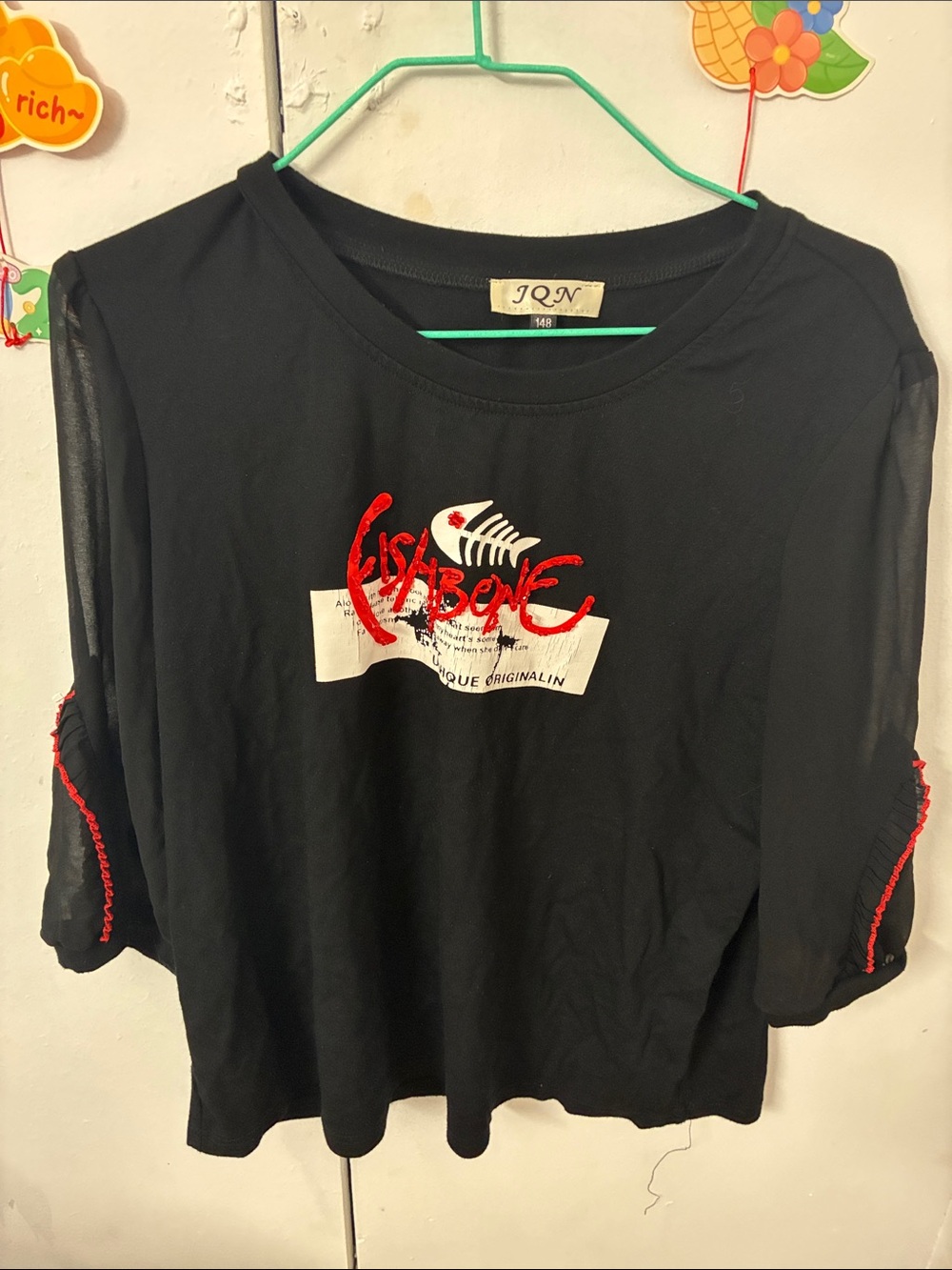 Black Women's Graphic Top with Red Accent